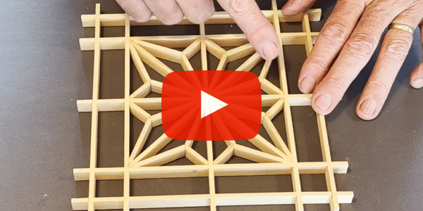 Image shows a Kumiko Asa-No-Ha pattern and two hands